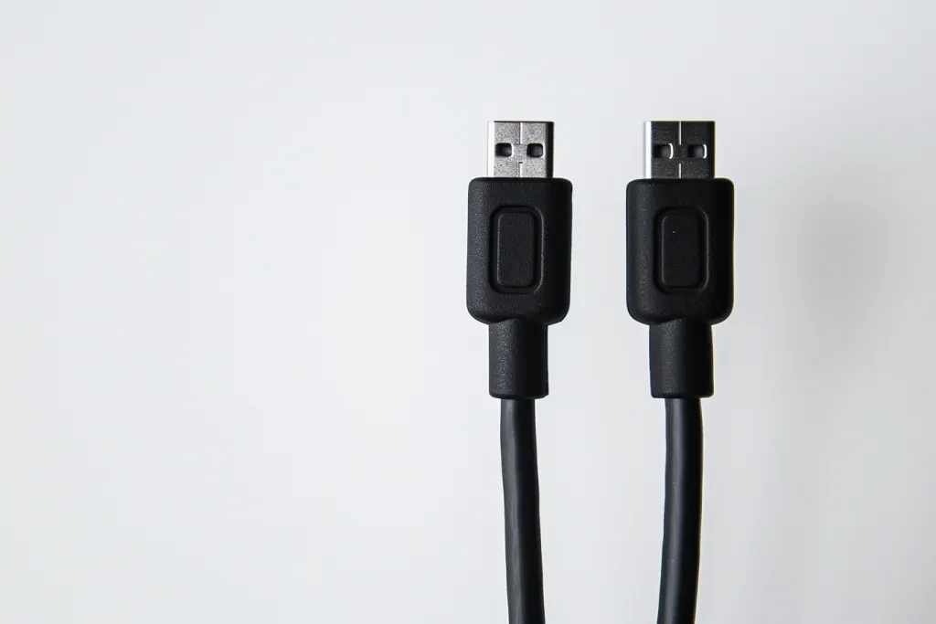 A black 6 foot micro-USB charging cable against a white background