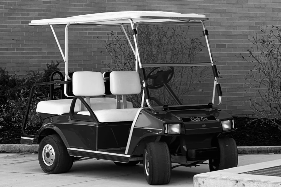 A black and white photo of a golf cart