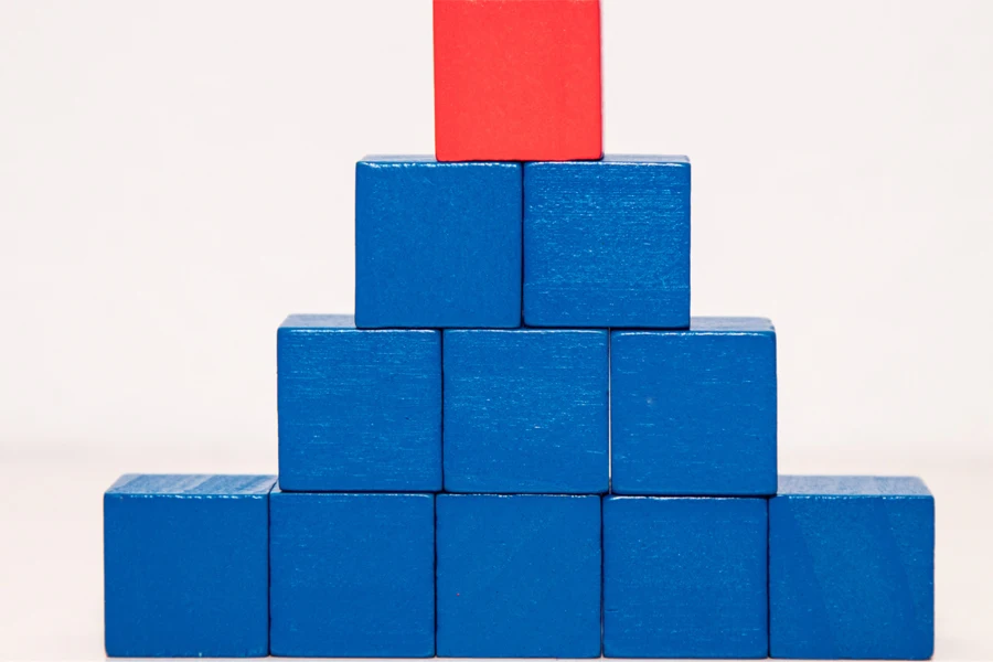 A block of blue bricks arranged with a red brick on top