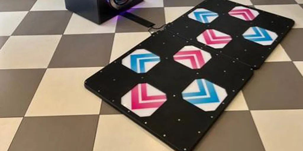 A dance mat connected to an arcade machine