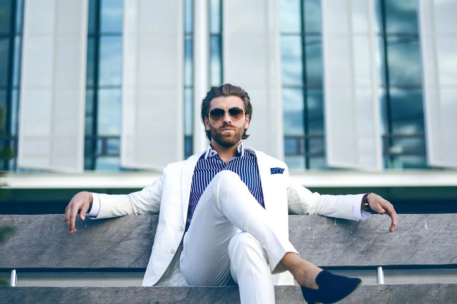 A male fashion influencer on suit and shades