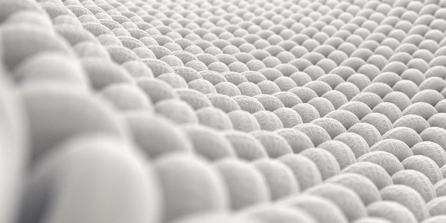 A microscopic close up view of a simple woven textile on a white background