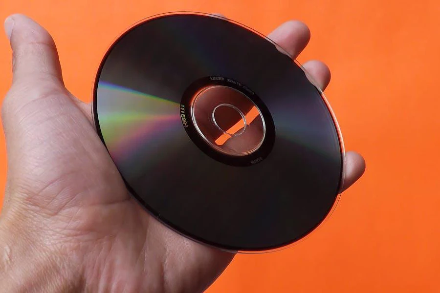 A person holding a CD
