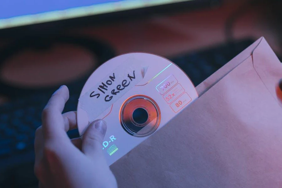 A person holding a compact disc