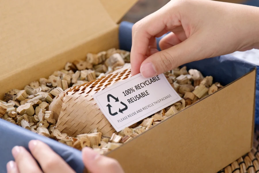 A person holding a product in sustainable packaging