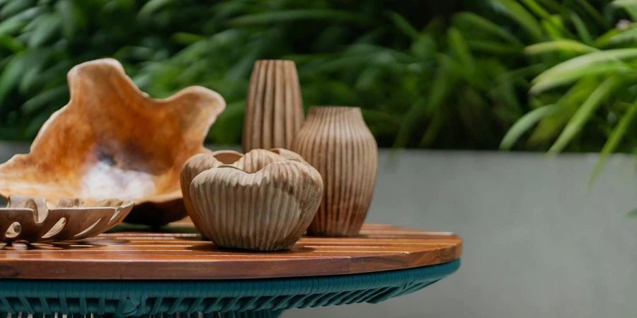 A table with a vase and some other items