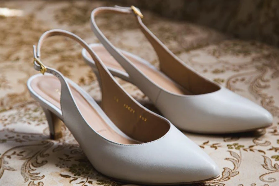 A white pair of slingback heels