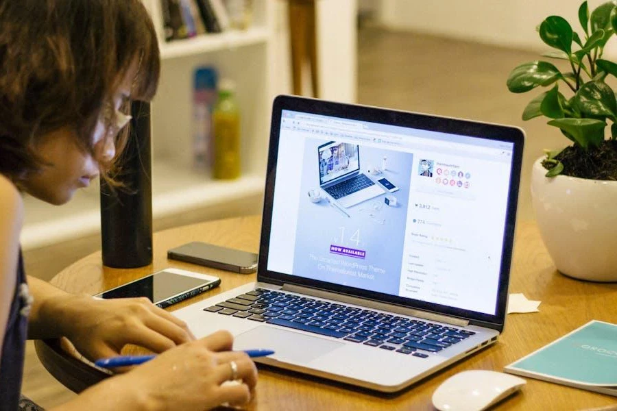 A woman studying the competition on her laptop