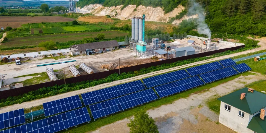 Aerial view of electrical power plant with rows of solar photovoltaic panels for producing clean ecological electric energy at industrial area
