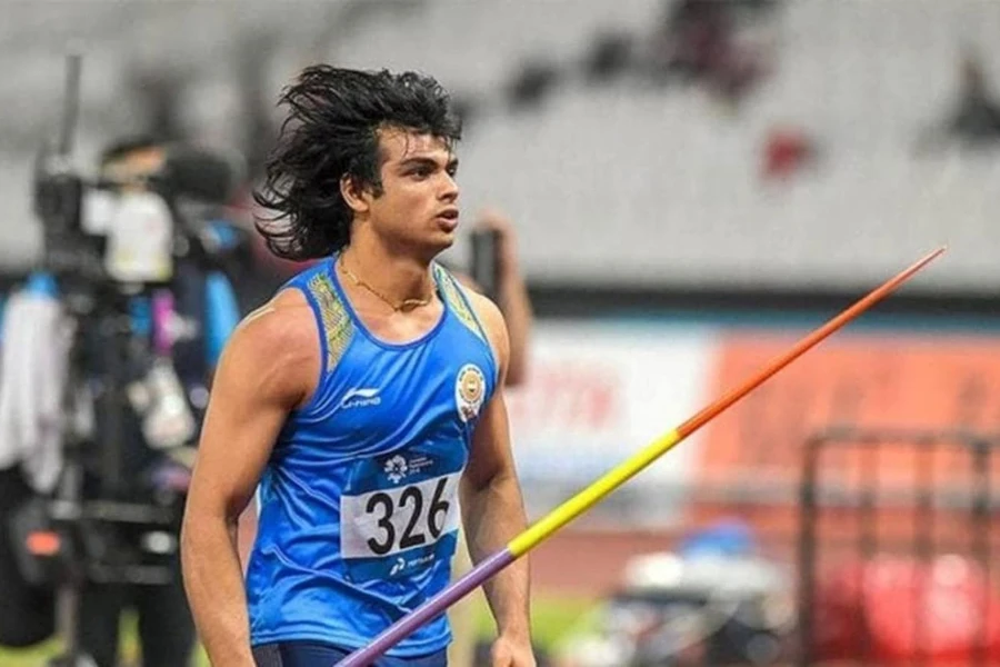 Athlete with long hair holding an Olympic-grade javelin