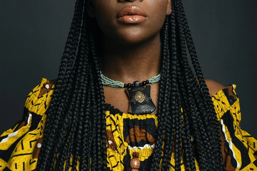 Attractive Woman with African Pigtails Hairstyle in Yellow Dress