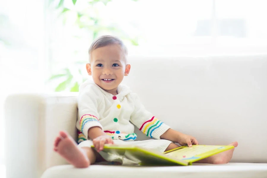 Baby boy reading a book