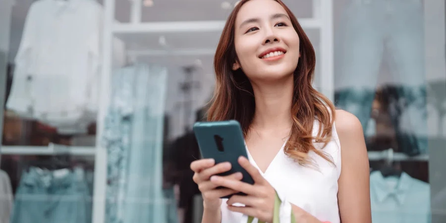 Beautiful asian female woman girl holding shopping bag