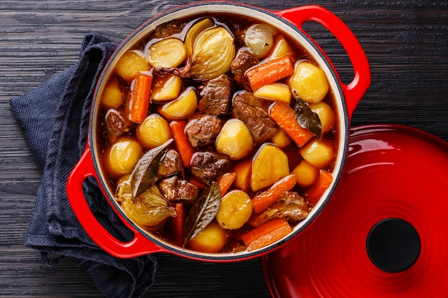 Beef meat stewed with potatoes in cast iron pot