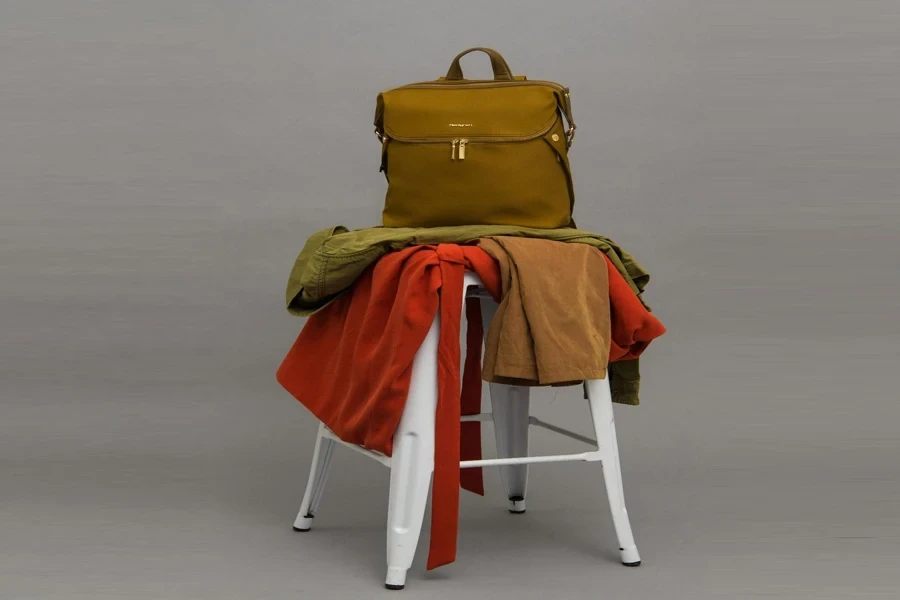 Brown Bag On Top Of Stool With Textiles