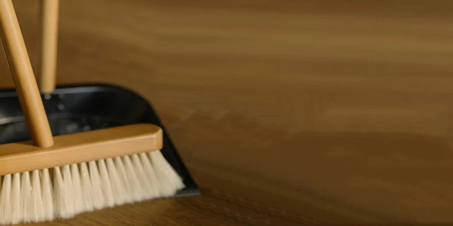 Brown Wooden Brush on Black Plastic Container