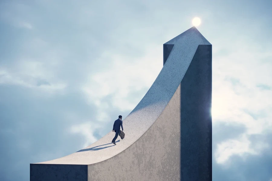 Business man running on an arrow shaped bridge to the top light. (3d render)