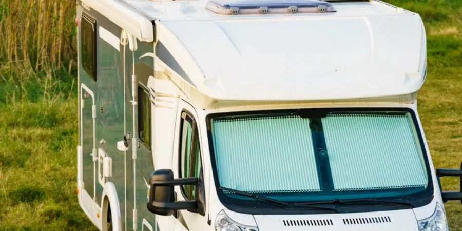 Camper with internal thermal screen blind at window pane