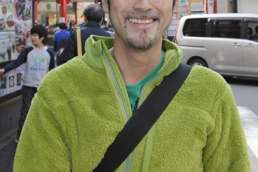 Chinatown Japanese man, wearing a packable fleece