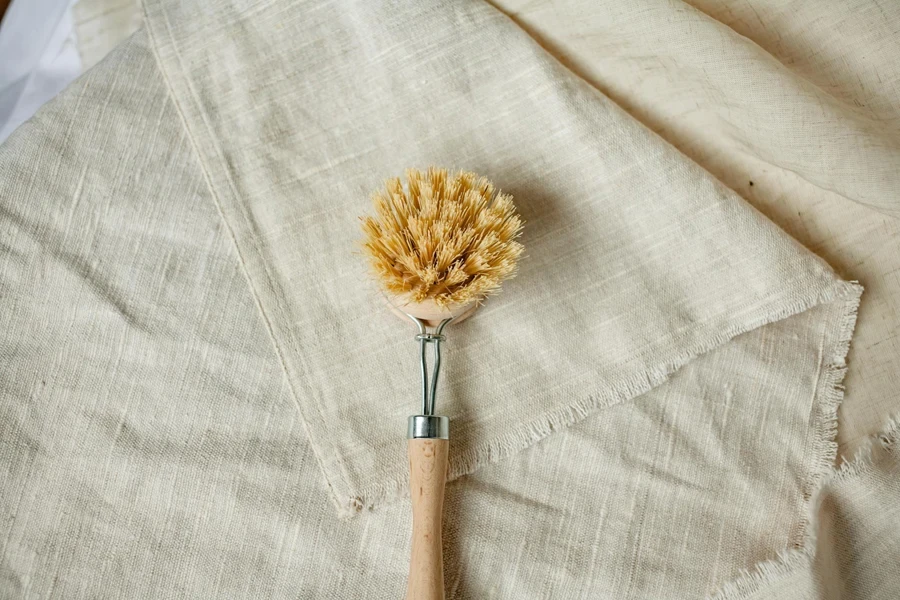 Close-up of a Cleaning Brush Lying on Linen Fabric