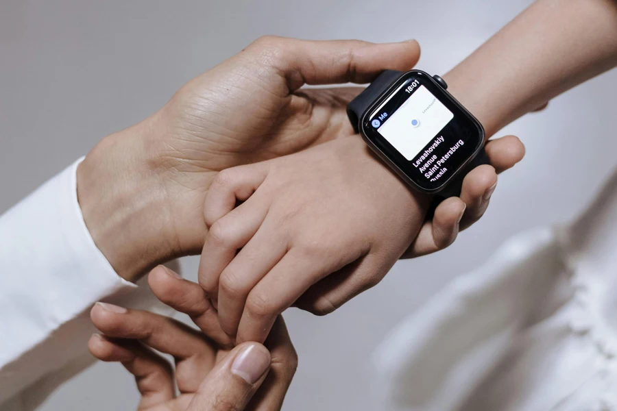 Close-up of hands with smartwatch