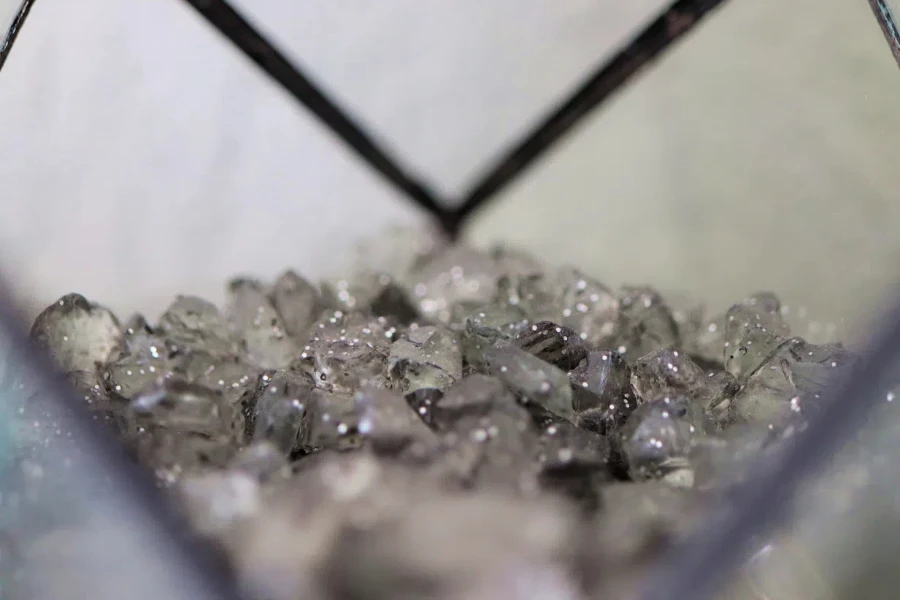 Close up of sparkly mineral rocks in a glass container