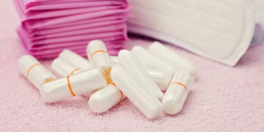 Close-up of the hands of a woman holding some tampons