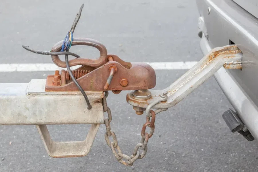 Closeup the grungy tow car with connected hook and chain