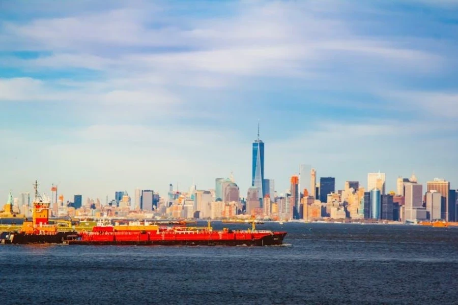 Container ships passing through the ocean under the blue sky