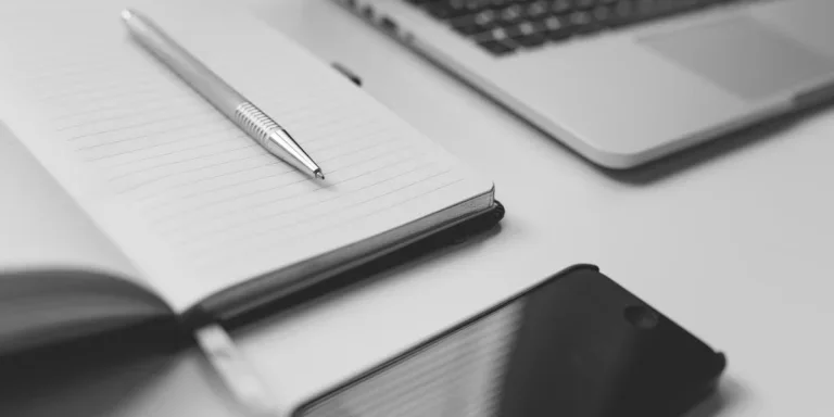 Different copywriting equipment on a white table