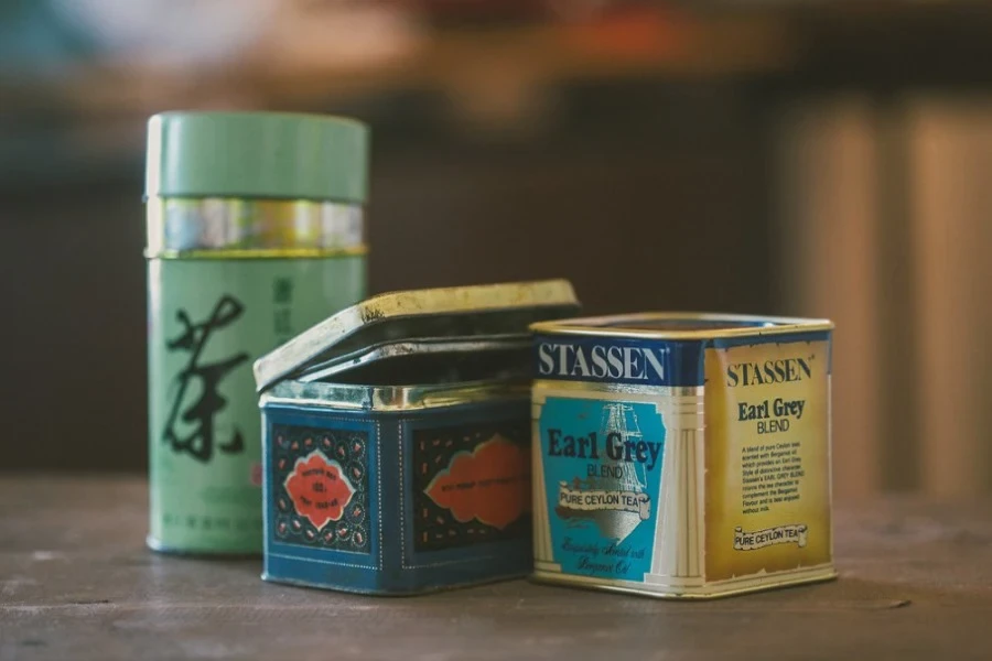 Different tea blend boxes and a thermal mug