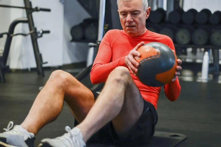 Elderly man performing core exercises