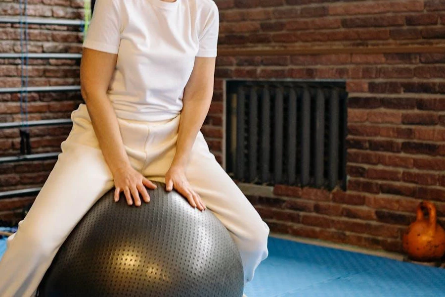 Elderly woman balancing on a stability ball