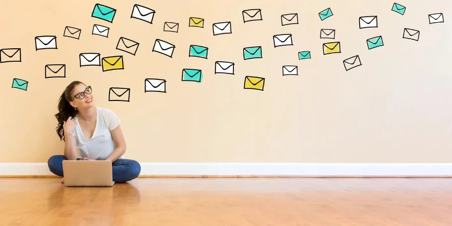 Email with young woman using a laptop computer