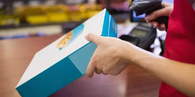 Female worker scanning cereal box