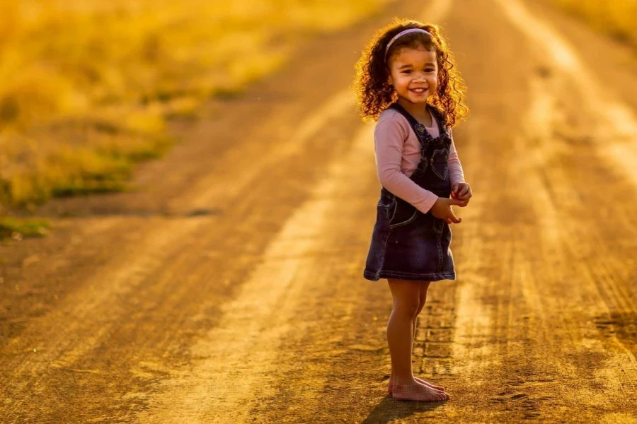 Girl Standing in the Middle of the Road