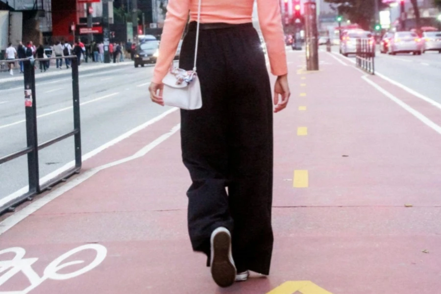Girl in Pink Blouse Walking Along Bike Path