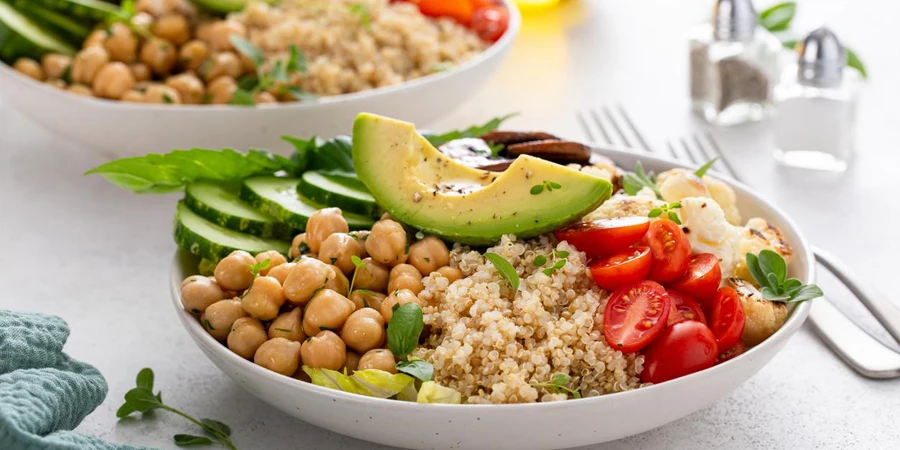 Healthy high protein vegan plant based lunch bowl with mushrooms, roasted cauliflower, chickpeas and quinoa