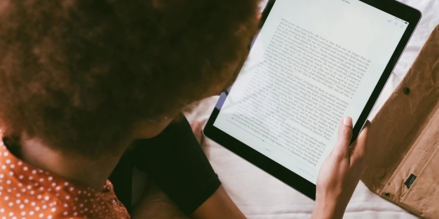 High Angle Photo of Person Reading an E-Book