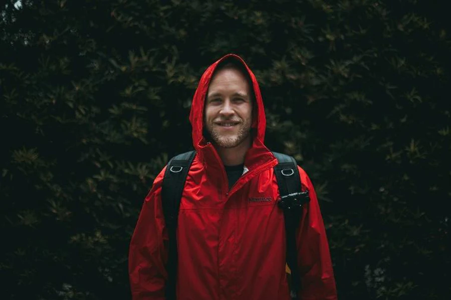 Hiker wearing red waterproof jacket