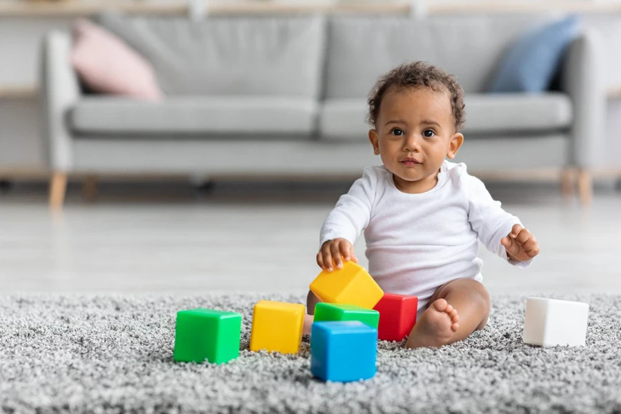 Infant Baby Playing With Stacking Building Blocks