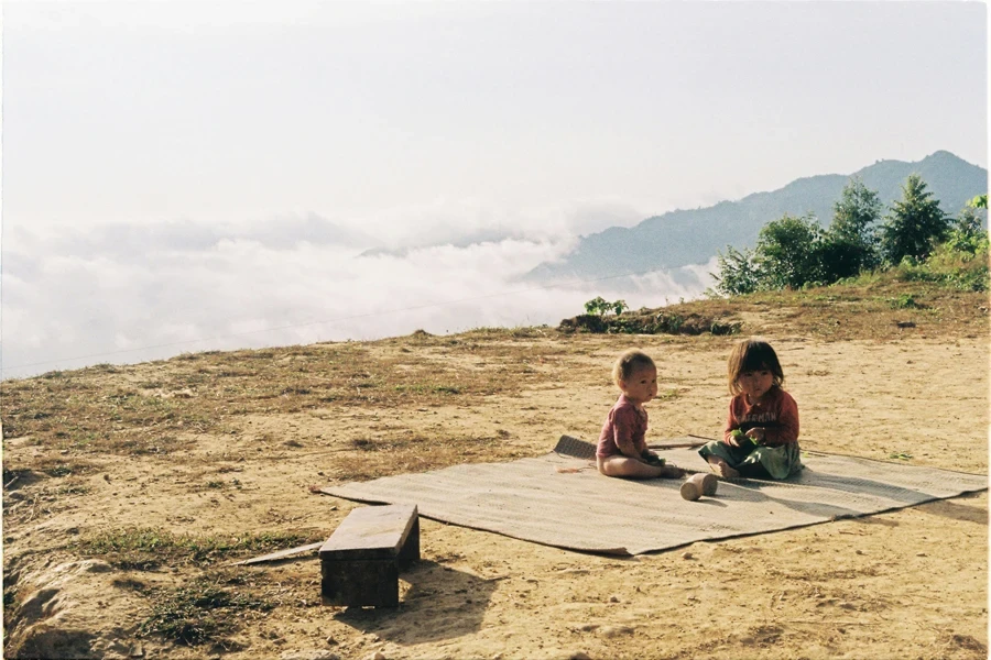 Kids Sitting on a Mat