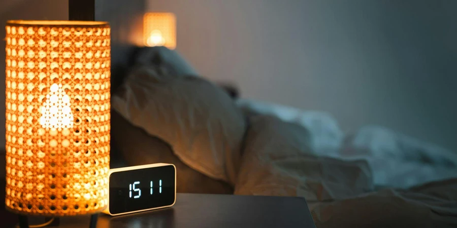 LED Lamp and Smart Table Clock lying on table