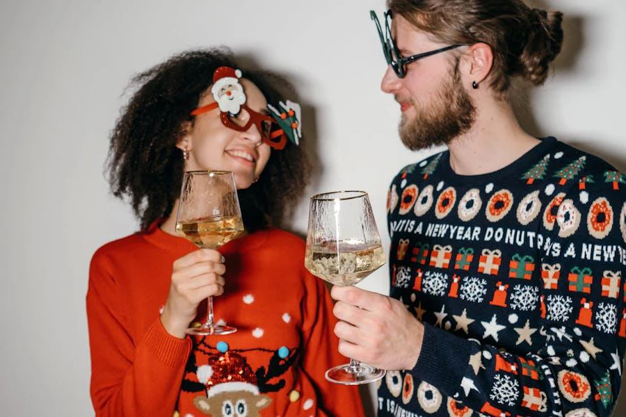 Lady and man posing in print-heavy Christmas outfits
