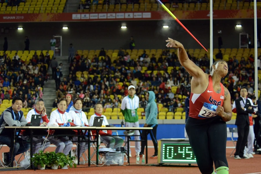 Lady completing an explosive javelin throw