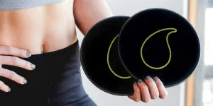 Lady holding a pair of black core sliders