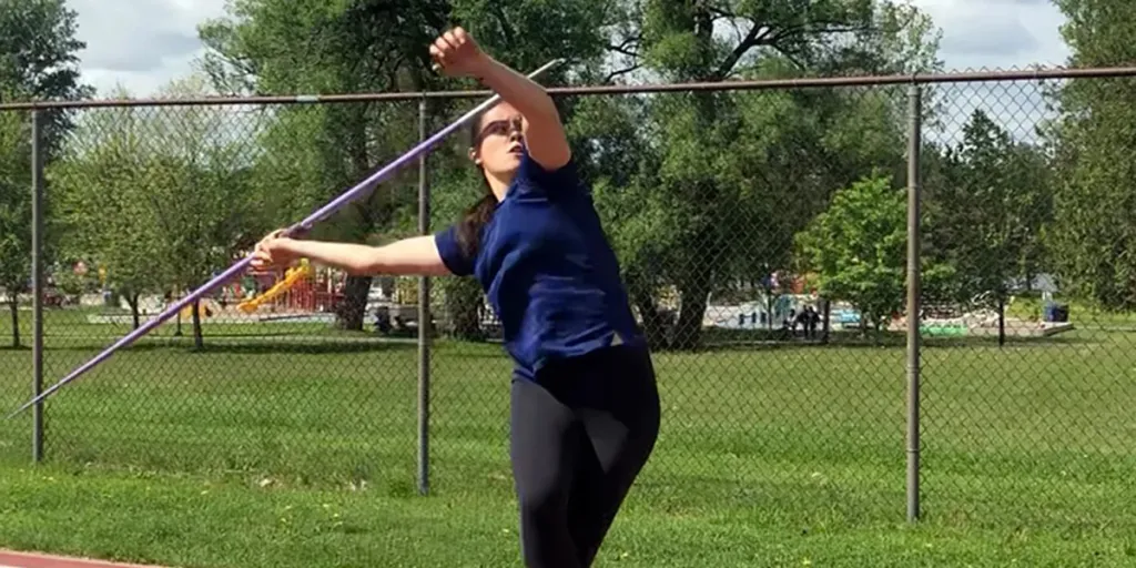 Lady practicing her technique on a training field