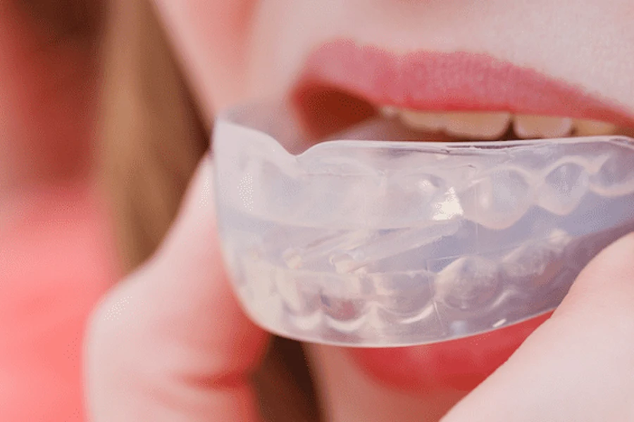 Lady wearing a white mouthguard