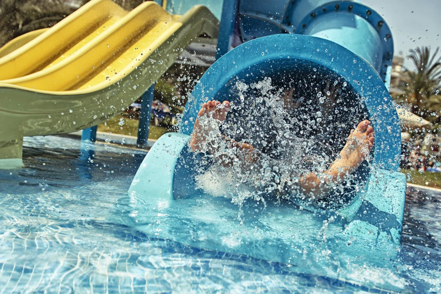 Little girl in water park. Actually little feet in waterpark.