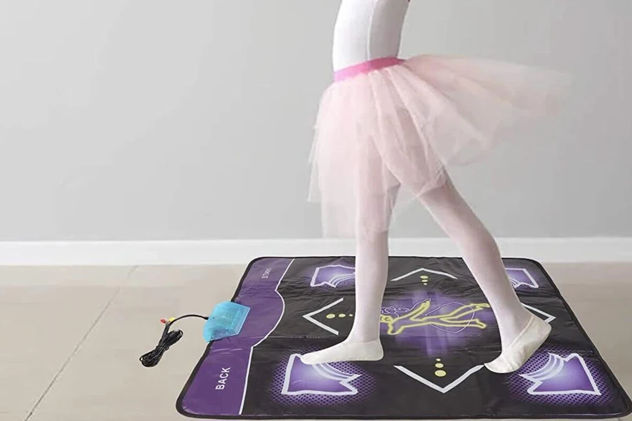 Little girl practicing on a dance pad
